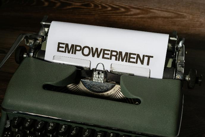 a close up of a typewriter with a piece of paper on it